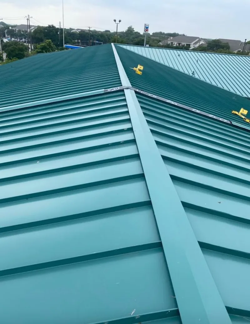 Green commercial metal roof ridge and valley for Metal Roof Repair in Leeds